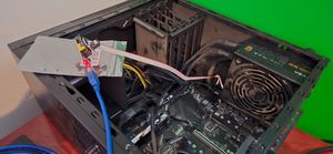 Image of computer with programmer attached